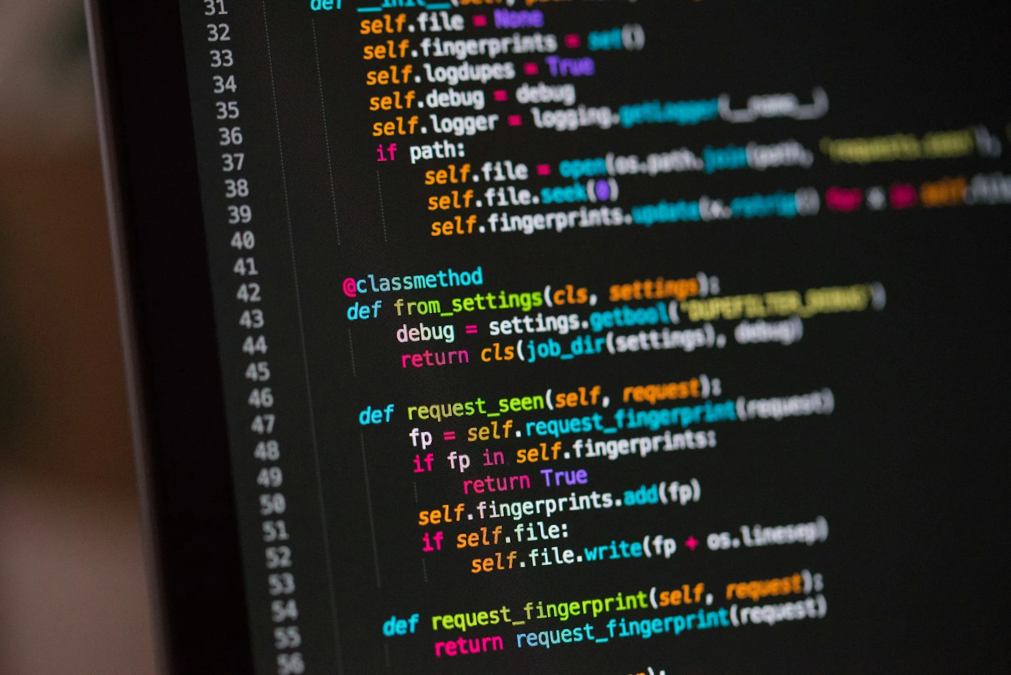A close-up of code on a laptop screen, illustrating programming